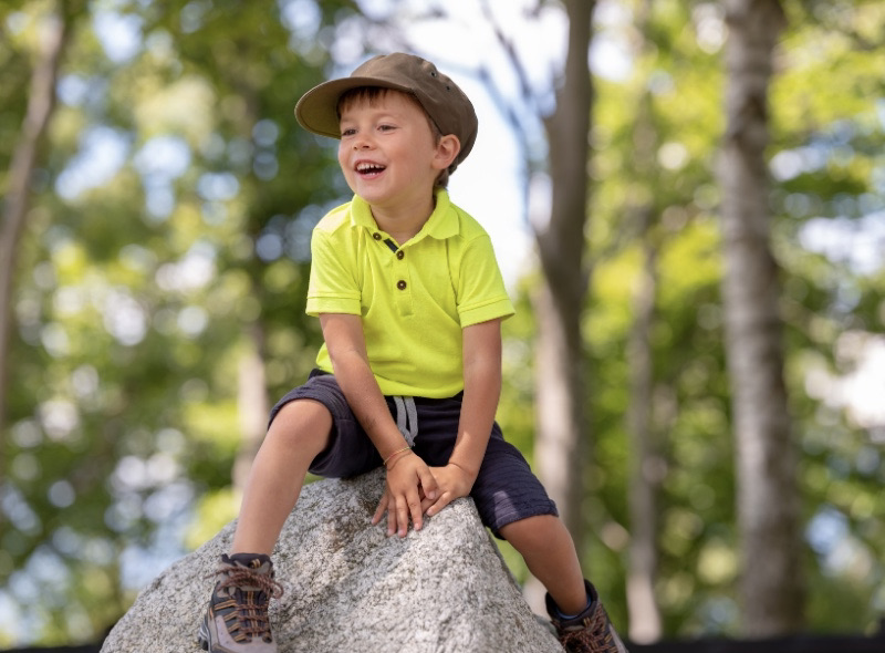 child climbing in nature