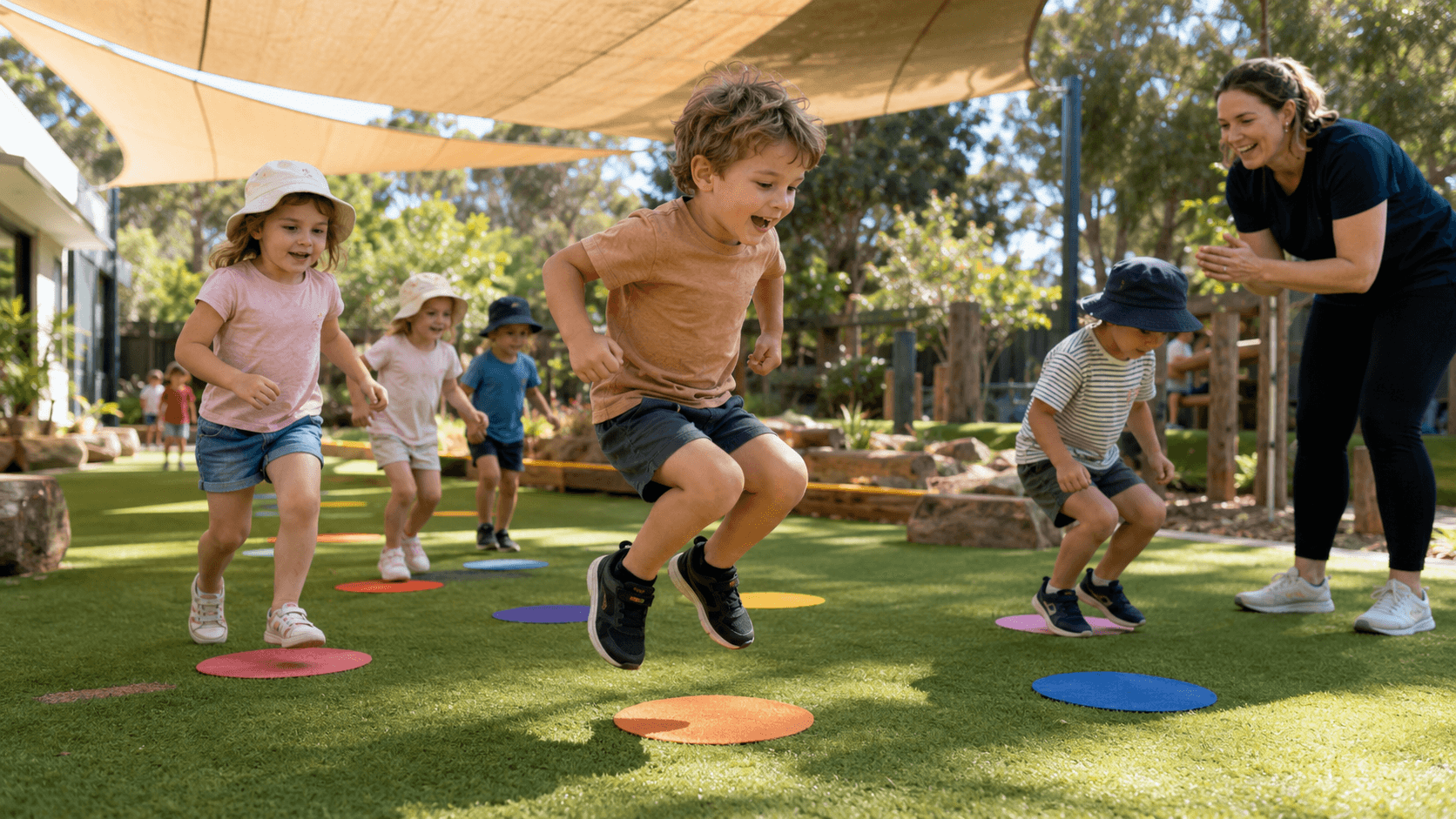 Children jumping like kangaroos outdoors to practise gross motor skills and energetic play.